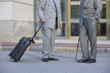 Photo: Two well dressed businessmen talking in front of office Two well dressed businessmen talking in front of office