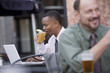 Photo: Two men working at a cafe Two men working at a cafe