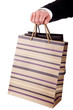 detail of a hand of a man doing shopping,with bags