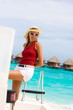 Lady stands abovedeck white yacht Lady stands abovedeck white yacht