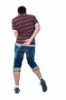 Young man dancing. Rear view. Young man dancing. Rear view.