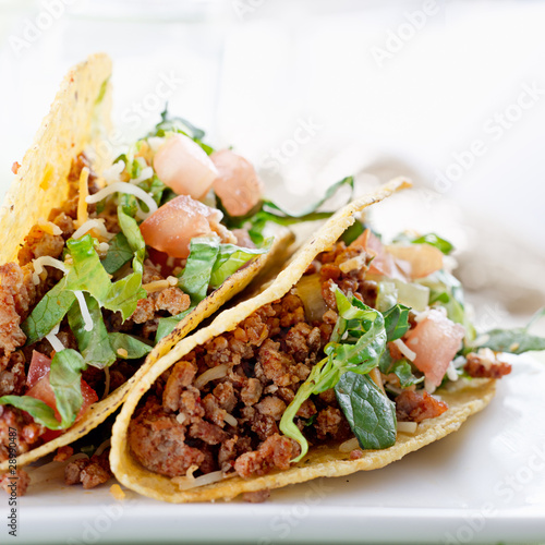 Photo: Beef tacos with lettuce cheese and tomato Beef tacos with lettuce cheese and tomato