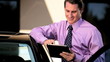 Businessman Using a Wireless Tablet Outdoors