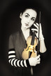 woman mime playing the violin woman mime playing the violin
