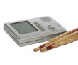 Metronome and drum sticks on white background