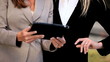 Smart Female Executives with Modern Wireless Tablet