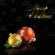 Red and gold christmas balls on black background