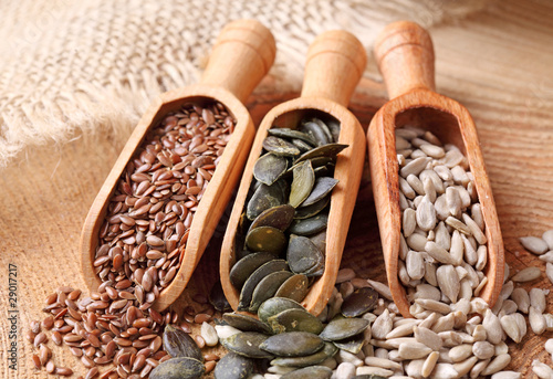 Photo: Flax, pumpkin and sunflower seeds in wooden spoons Flax, pumpkin and sunflower seeds in wooden spoons