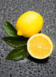 Fresh lemon fruit on wet surface