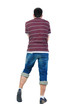 Young man dancing. Rear view. Young man dancing. Rear view.