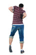 Young man dancing. Rear view.