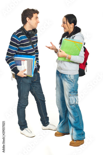 Photo: Students couple having conversation Students couple having conversation