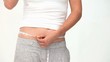 Woman looking ar her waistline
