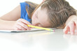 Photo: Sleepy child at school work Sleepy child at school work