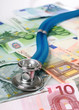 Stethoscope and euro money.