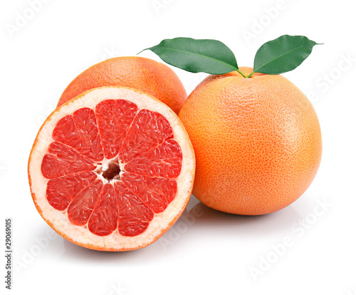 Photo: Grapefruit fruits with cuts and green leaf isolated Grapefruit fruits with cuts and green leaf isolated