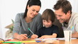 Parents looking at their lovely son drawing