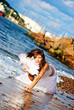 Sexy woman with fan on a beach Sexy woman with fan on a beach