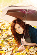 Girl is lying on autumn leaves Girl is lying on autumn leaves