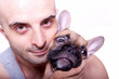 Foto: Little french bulldog puppy with a guy Little french bulldog puppy with a guy