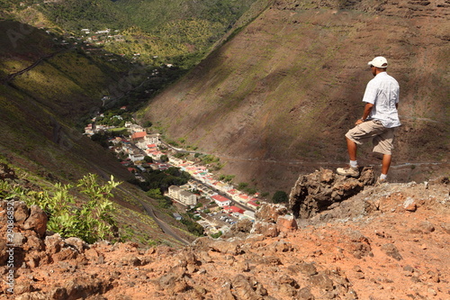 Photo: Man hiking above Jamestown St Helena Island Man hiking above Jamestown St Helena Island