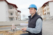 Supervisor using electronic tab on construction site Supervisor using electronic tab on construction site