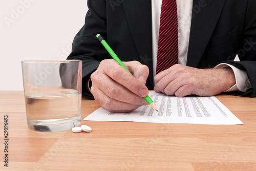 Photo: Business budget stress headache - differential focus Business budget stress headache - differential focus