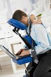 Businessman getting neck massage