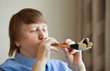 Elderly woman playing music