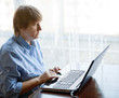 Senior woman with computer
