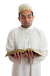 Man reading a religious or other book