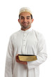 Man holding a book and smiling