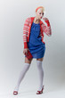 emotion pose blond girl in red woolly