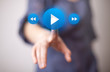 hand pressing play button