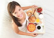Breakfast in bed woman