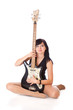 a beautiful young woman with electo guitar