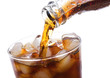 Cola is pouring into glass