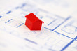 Red model house with architecture plan