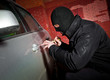 robber and the thief in a mask hijacks the car