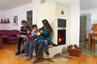 family sitting on the bench of a masonry stove 01 family sitting on the bench of a masonry stove 01