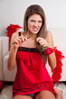 Beauty, young girl break a red rose