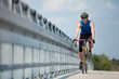 Foto: Professional biker riding on race bike Professional biker riding on race bike