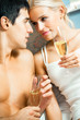 Young happy amorous couple with champagne at bedroom Young happy amorous couple with champagne at bedroom