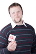 Young man holding valentine gift in his hand Young man holding valentine gift in his hand