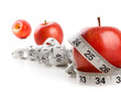 Red apples and measuring tape on white Red apples and measuring tape on white