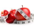 Red apples,heart and measuring tape on white Red apples,heart and measuring tape on white