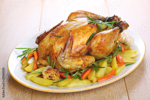 Photo: Whole roasted chicken with vegetables and rosemary Whole roasted chicken with vegetables and rosemary