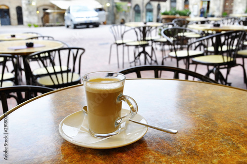 Photo: Cafe latte at the terrace of an italian cafe Cafe latte at the terrace of an italian cafe