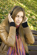 Young woman with headphones in the park