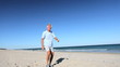 Senior Male Fun Exercise on the Beach